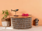 Round hand carved mango wood coffee table with white-washed base and natural wood top; 90 cm diameter, 45 cm height.
