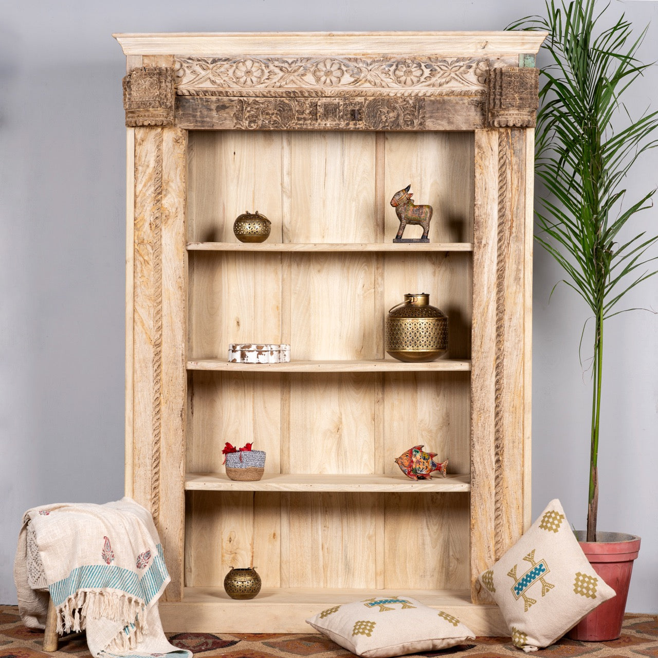 Hand-carved shelf made from reclaimed teak wood and mango wood, unique furniture with Ibiza-inspired finish, 150 × 208 × 52 cm.