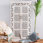 Hand-carved mango wood cabinet with floral and geometric patterns in white-wash finish – carved wooden furniture and artisanal furniture with Mediterranean charm.